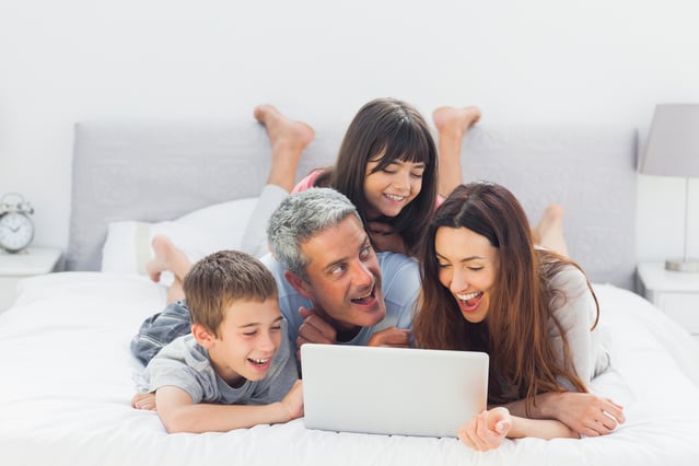 Happy family engaging with educational resources,
