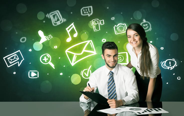 Childcare business owners planning social media strategy to engage families
