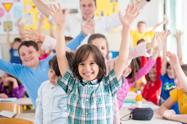 Cheerful group of kids wtih their teacher in a Childcare