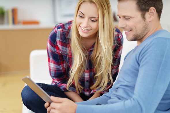 Parents viewing childcare marketing updates on a phone