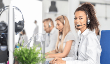 woman with headset: new phone number announcement