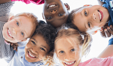 children smiling in circle