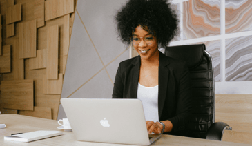 woman typing on laptop at desk