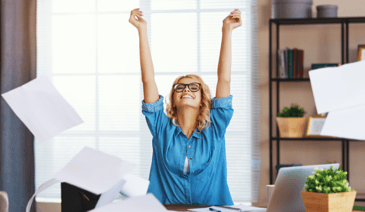 blonde woman with glasses throwing papers up in the air