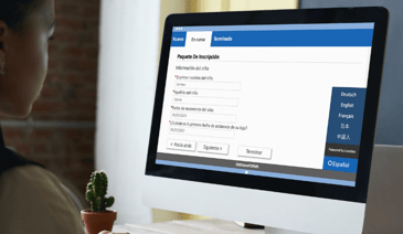 woman filling out online childcare registration forms in spanish