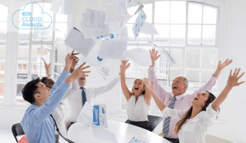 team cheering, papers in air 