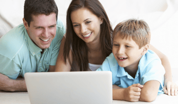 family on laptop - tips for daycare ads
