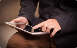 Person holding and using a smartphone.