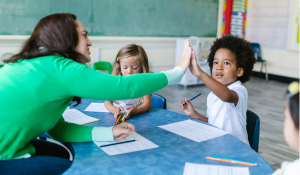 teacher engaging with children